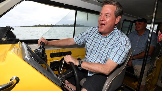 Queensland Opposition Leader Tim Nicholls pilots a Volunteer Marine Rescue boat on Moreton Bay. Picture: AAP/Dan Peled