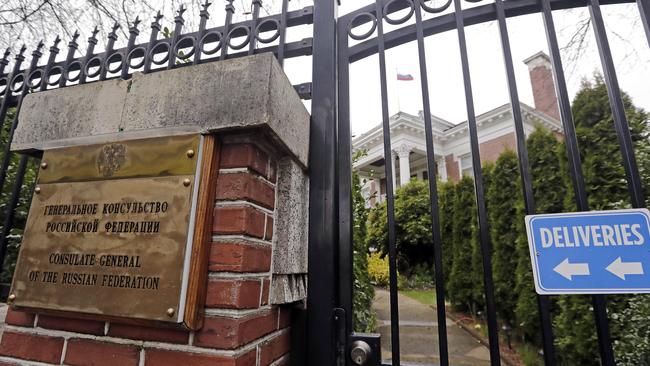 A metal fence surrounds the residence of Russia’s consul general in Seattle which has been ordered to close. Picture: Elaine Thompson/AP