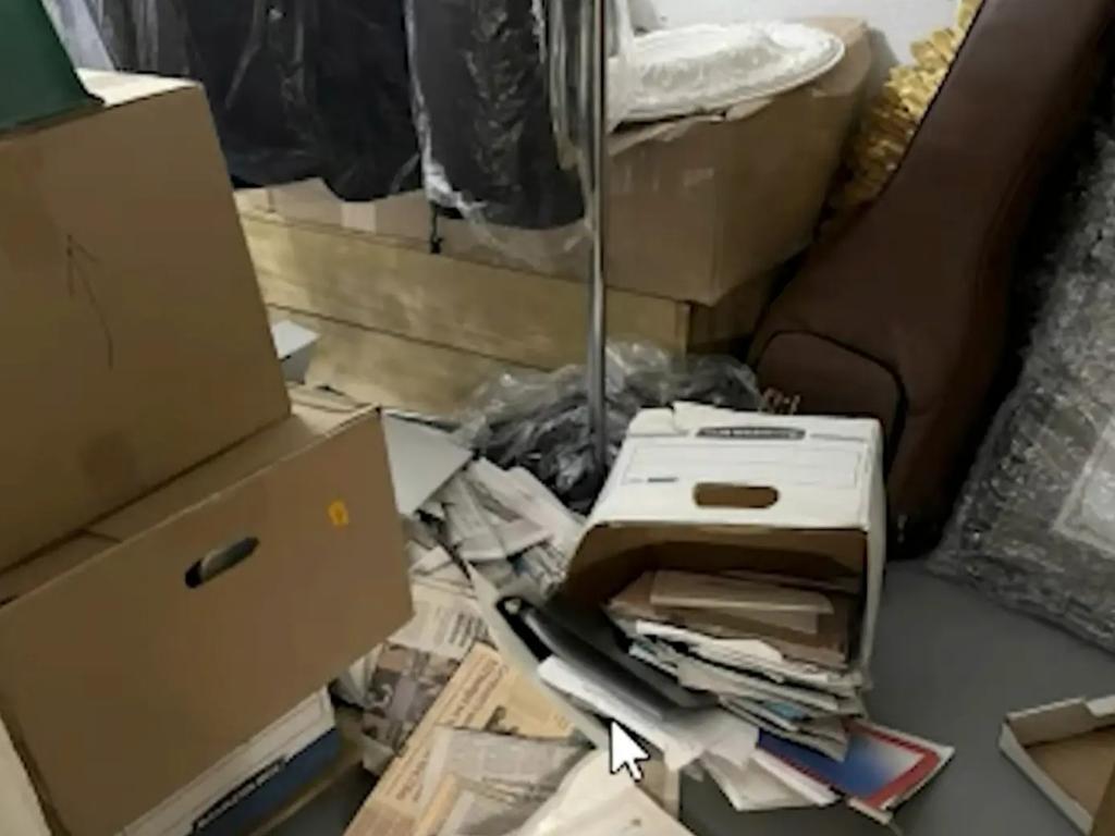 Documents are seen falling out of boxes. Picture: Department of Justice