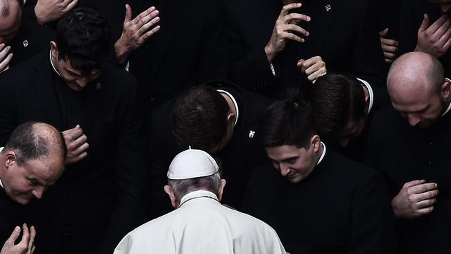 Pope Francis prays with priests at the San Damaso courtyard in the Vatican in 2020. Picture: AFP