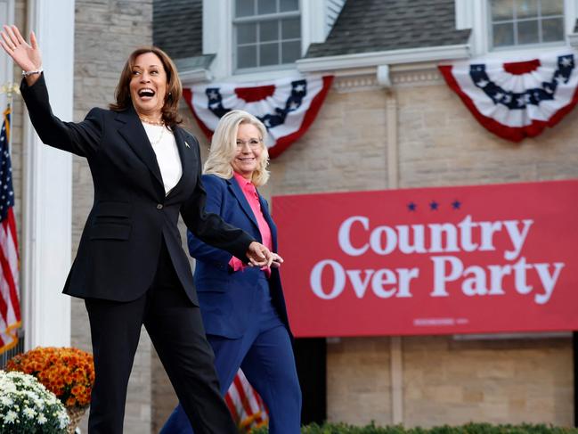 TOPSHOT - US Vice President and Democratic presidential candidate Kamala Harris and former US Representative Liz Cheney (R) arrive for a campaign event at Ripon College in Ripon, Wisconsin, October 3, 2024. (Photo by KAMIL KRZACZYNSKI / AFP)