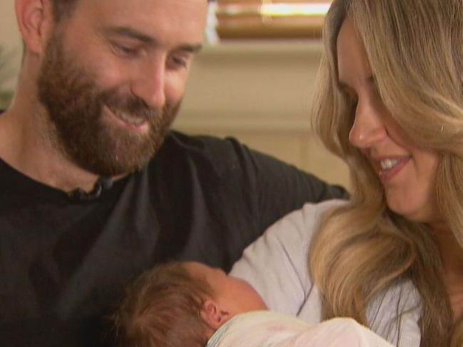 A Perth father has turned midwife in the emergency lane of a busy freeway, helping to deliver his baby on the front seat of their four-wheel drive.