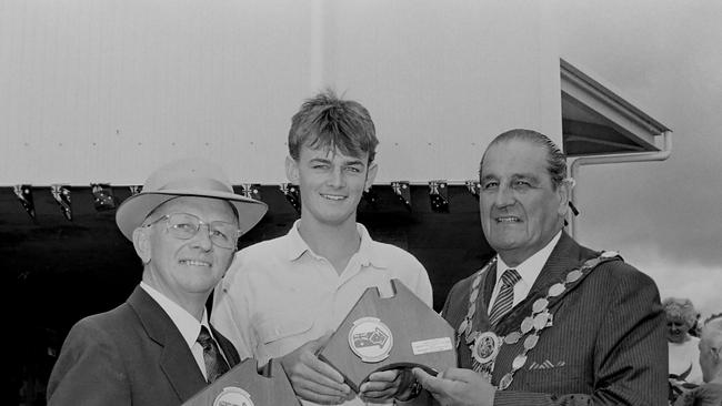 Now recognised all over the world, Adam Gilchrist is pictured with Citizen of the Year, Bunny Hauville and the Mayor of Lismore, Ald Harold Fredericks, after being named Lismore Citizen of the Year for sport. Photo: The Northern Star Archives