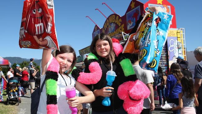 The Cairns Show Association hosts a Covid-safe mini Cairns Show in 2020, with Alexandra Wade, 10, and Jolanda Wade, 14, excited to score showbags and prizes. PICTURE: BRENDAN RADKE