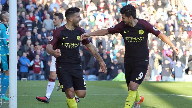 Manchester City's Sergio Aguero (L) celebrates scoring.