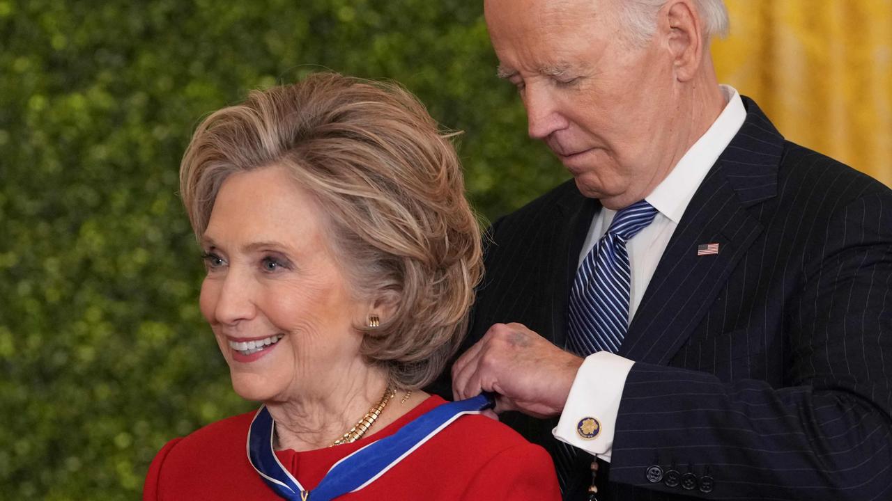 Hillary Clinton receiving her medal. Picture: Chris Kleponis/AFP