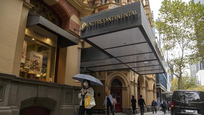 People walk past the Intercontinental Hotel on Collins Street in Melbourne, May 04, 2021. Photo: Daniel Pockett / The Australian