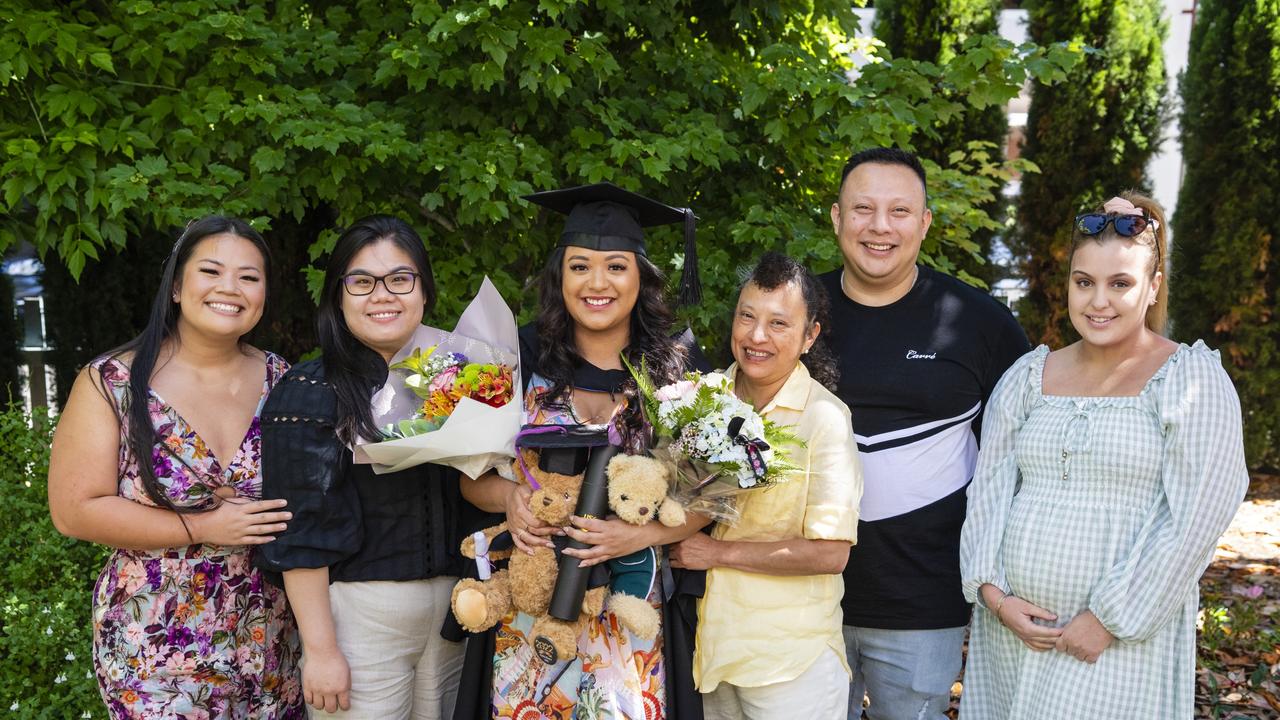 Bachelor of Paramedicine graduate Katherine Rivera with friends and family (from left) Cathy Nguyen, Ellie Le, Sonia Rivera, Christian Rivera and Laura Sharp at the UniSQ graduation ceremony at Empire Theatres, Wednesday, December 14, 2022.