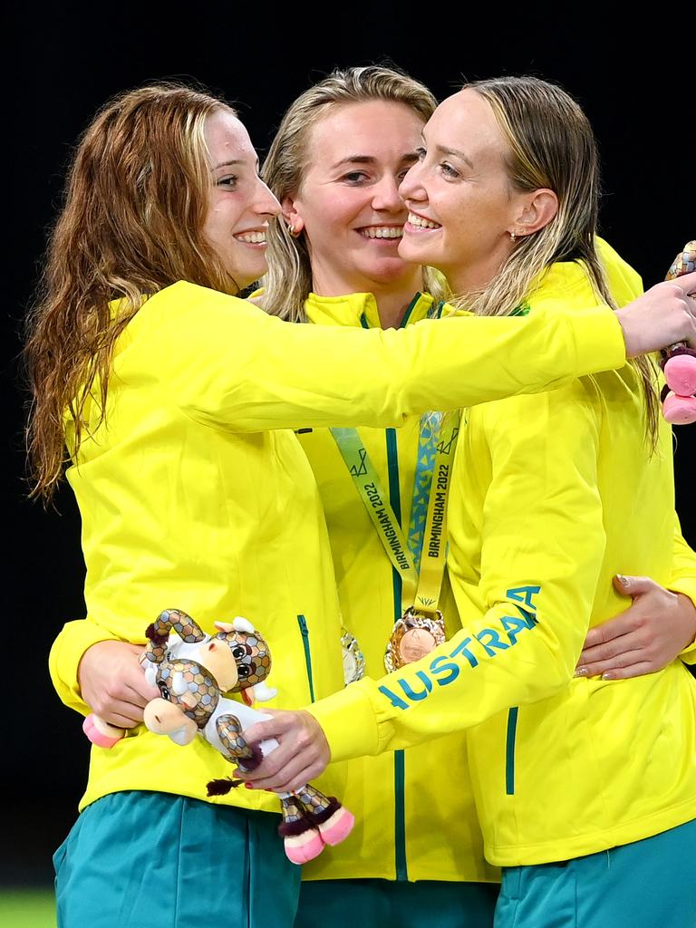 The Aussie trio embrace after their medal moment.