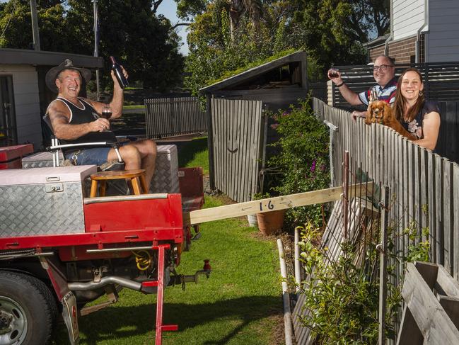 Gus Rogers socialises from a distance with his neighbours, Christine and Stephen Bailey at Point Lonsdale Picture: Rob Leeson