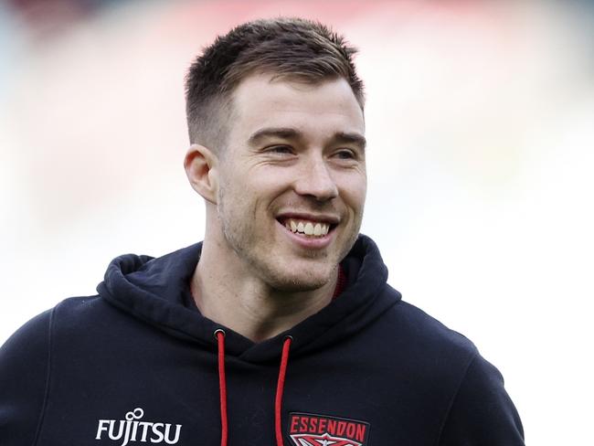 MELBOURNE, AUSTRALIA - AUGUST 04: Zach Merrett of the Bombers warms up during the round 21 AFL match between Essendon Bombers and Fremantle Dockers at Melbourne Cricket Ground, on August 04, 2024, in Melbourne, Australia. (Photo by Martin Keep/AFL Photos/via Getty Images)