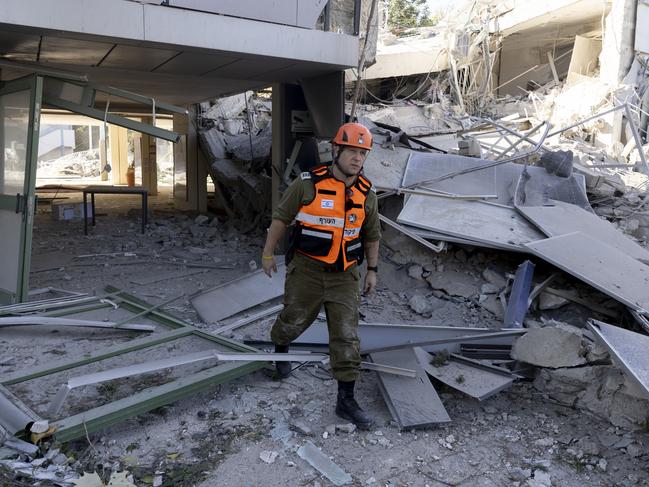 RAMAT GAN, ISRAEL - DECEMBER 19: An emergency responder inspects damage of a school in the city after a rocket strike, allegedly fired from Yemen, on December 19, 2024 in Ramat Gan, Israel. In response, Israel launched attacks on several Houthi military targets in Yemen earlier this morning, including ports, power plants, and oil factories in Sanaa and Hodeidah. (Photo by Amir Levy/Getty Images) *** BESTPIX ***