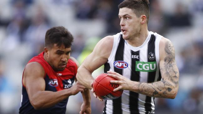 Jack Crisp breaks away during Collingwood’s win against Melbourne.