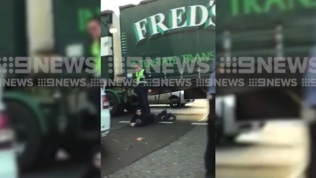 A man on the ground at the scene of the Port Melbourne road rage attack.