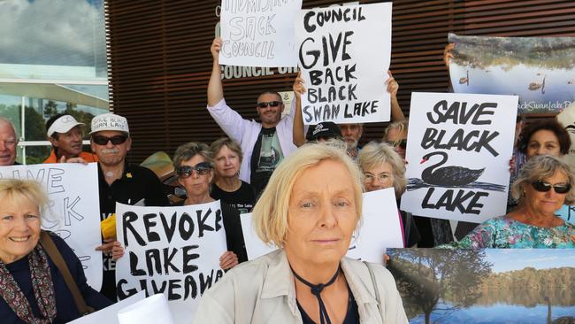 Sally Spain from Wildlife Queensland leads a group of protesters trying to save Black Swan Lake outside Gold Coast City Council Chambers. Picture: Glenn Hampson.