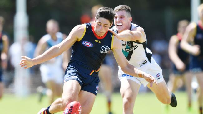 Chayce Jones and Joe Atley do battle during a pre-season hitout between Adelaide and Port Adelaide. Picture: AAP Image/David Mariuz