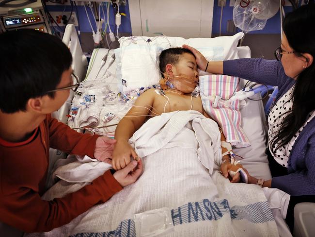 Issac Lee with his mum Karol and dad Ricky after a gruelling surgery. Picture: Sam Ruttyn