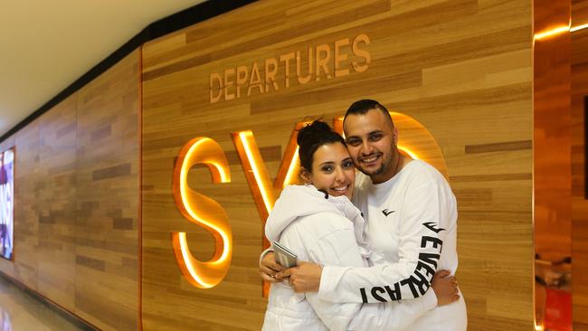 Rosemary Azmi and Kerlous Azmi are seen departing Sydney International Airport on their way to Singapore to celebrate on their honeymoon.. Picture: NCA Newswire / Gaye Gerard