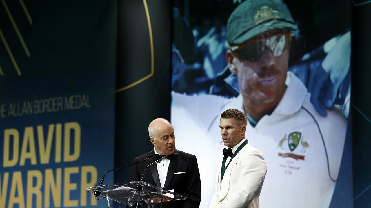 David Warner (right) accepts the Allan Border Medal on Monday night. Picture: Getty Images