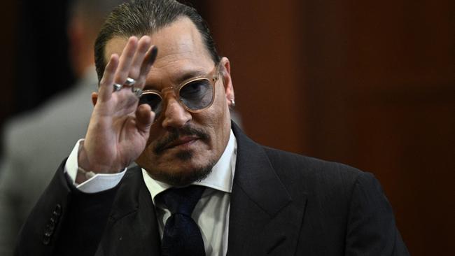 Johnny Depp gestures while departing the courtroom. Picture: AFP