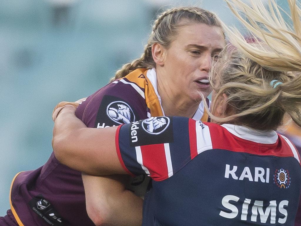 Julia Robinson of the Broncos (right) is tackled by Ruan Sims of the  Roosters during the