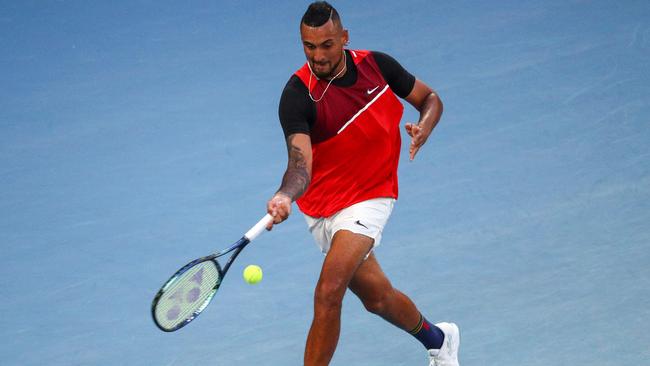 Nick Kyrgios hits a return against Daniil Medvedev. Picture: AFP Images