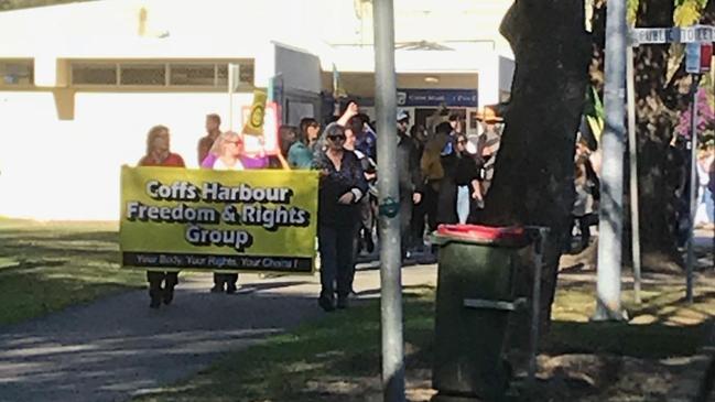 Protesters at the recent Freedom March in Coffs Harbour walk through the city. The Coffs Harbour Freedom and Rights group's Facebook page is filled with a great deal more than anti-vaccination messages.