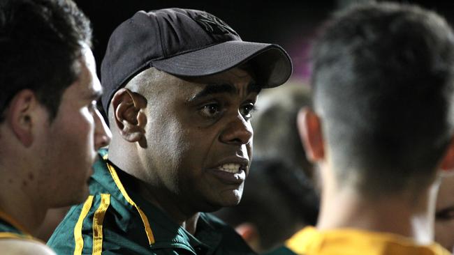 Eugene Warrior talks to his players at quarter time in the 2013 division one grand final replay, which was his last game in charge at Salisbury North before recently returning to the club as coach. Picture: Stephen Laffer