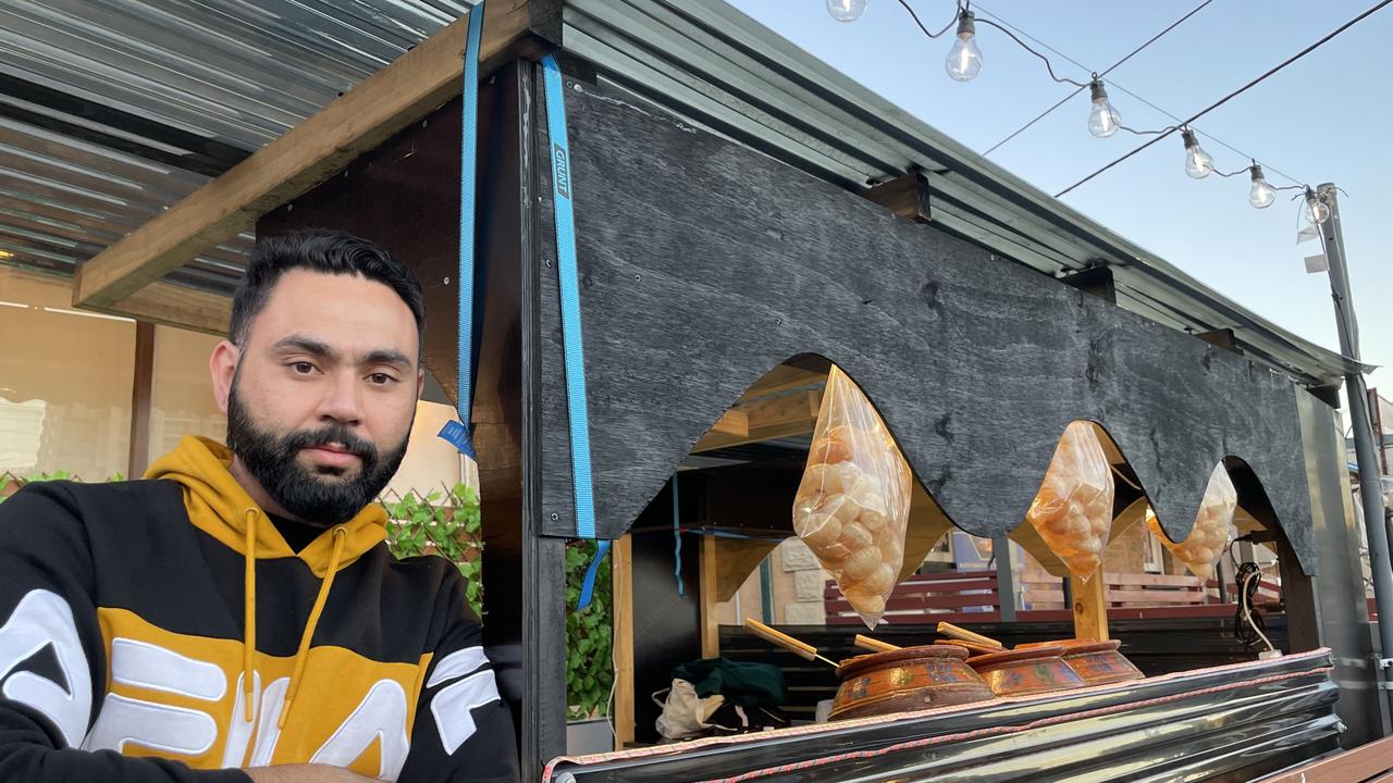 Papa Curry Harris Park owner Prince Raheja at the food cart outside his restaurant.