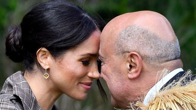 Meghan receives a “hongi”, or traditional Maori greeting, from an elder during an official welcoming ceremony at Government House in Wellington on Sunday. Picture: AFP