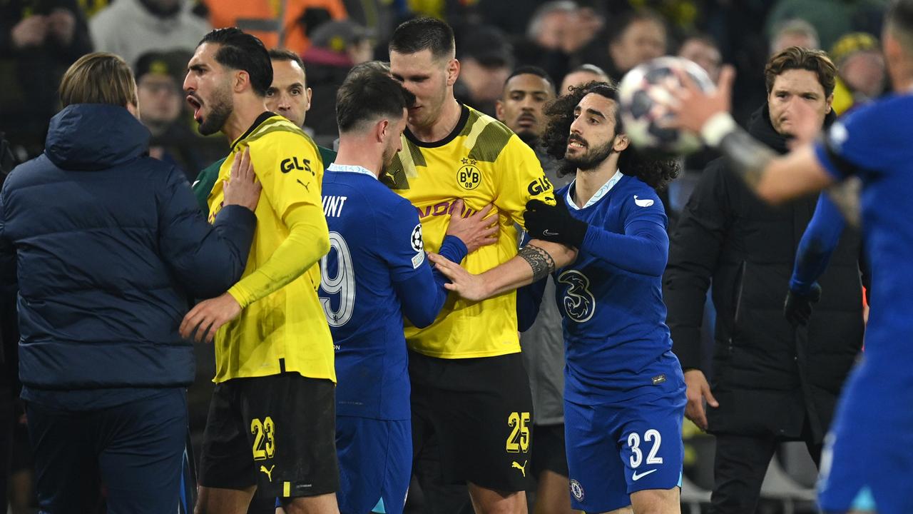 Marc Cucurella and Mason Mount of Chelsea clash with Niklas Sule and Emre Can of Borussia Dortmund during the UEFA Champions League round of 16 leg one match between Borussia Dortmund and Chelsea FC at Signal Iduna Park on February 15, 2023 in Dortmund, Germany. (Photo by Stuart Franklin/Getty Images)