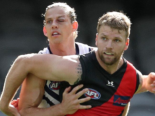 AFL Round 1. Essendon v Fremantle at Marvel Stadium..  21/03/2020.  Jake Stringer of the Bombers and Nat Fyfe of the Dockers    . Pic: Michael Klein