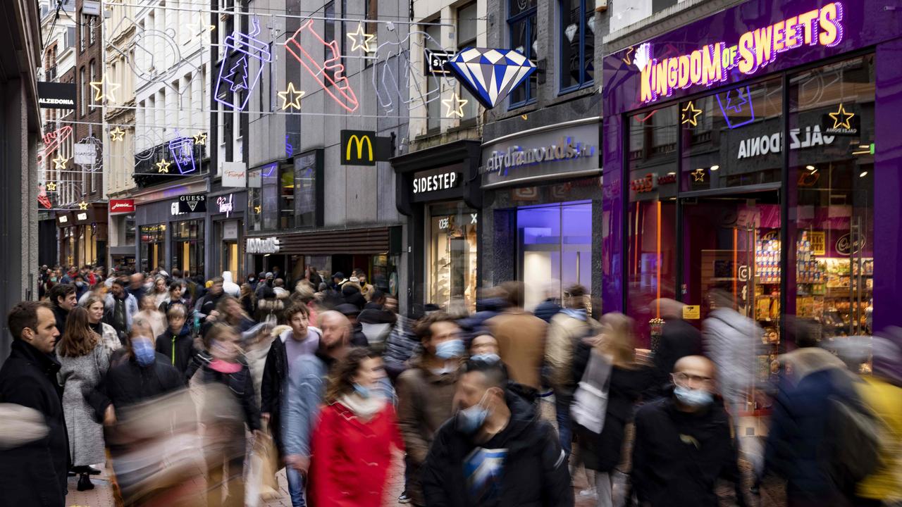 Shoppers wear protective face masks in Amsterdam. Picture: Ramon van Flymen/ANP/AFP