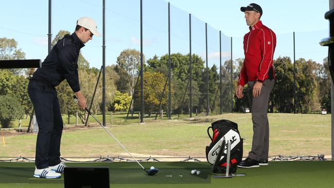 Golf Director of Instruction Richard Woodhouse (right) puts a student through “The Bunker’ program.Picture Glenn Hampson