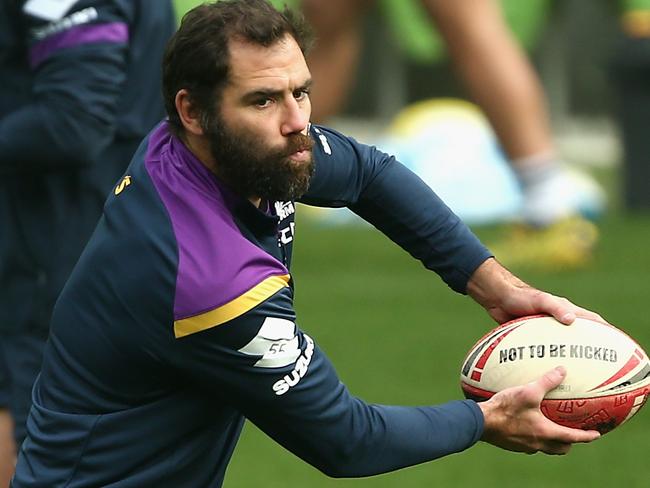 Cameron Smith looks to offload the ball during an NRL Storm training session at AAMI Park in Melbourne, Tuesday, May 26, 2020. (AAP Image/Rob Prezioso) NO ARCHIVING