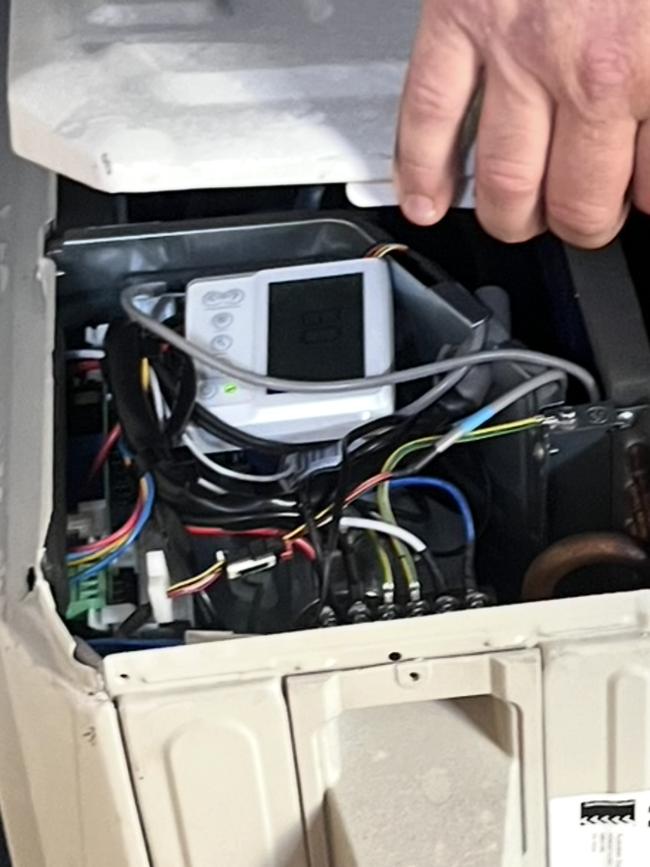 A heat pump unit where the user controls are installed inside the unit next to live wires. Experts have warned this could lead to electrocution. Picture: Supplied