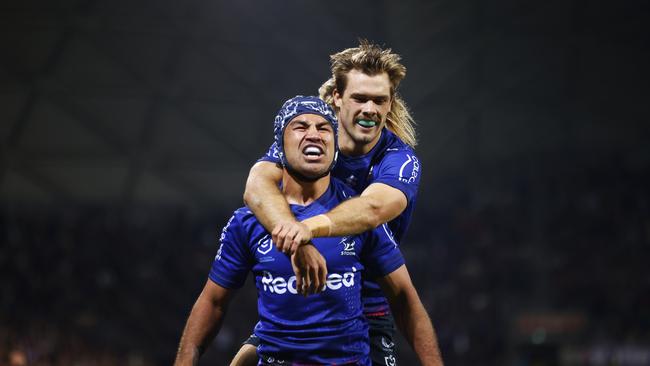 MELBOURNE, AUSTRALIA - APRIL 25: Jahrome Hughes of the Storm (L) celebrates scoring a try with Ryan Papenhuyzen of the Storm during the round seven NRL match between the Melbourne Storm and the New Zealand Warriors at AAMI Park, on April 25, 2022, in Melbourne, Australia. (Photo by Daniel Pockett/Getty Images)