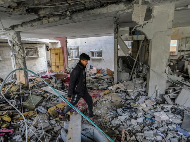 Palestinian citizens carry out search and rescue operations amid the destruction caused by Israeli air strikes in Khan Yunis, Gaza. Picture: Getty Images