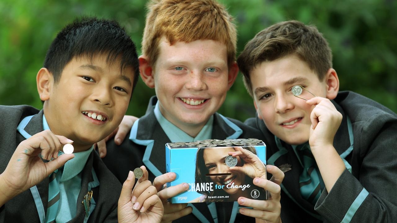 Geelong Grammar (Toorak campus) is participating in the Ygap 5cent campaign to raise money to improve access to education and resources for children in disadvantaged areas. L to r: grade 6 students Josh, Felix and Theodore (fundraiser co-ordinator) begin the fundraising exercise. Picture: Janine Eastgate