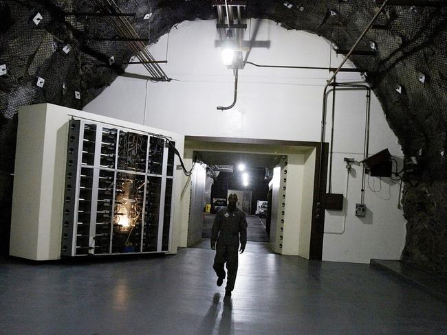 COLORADO SPRINGS, CO - MAY 11: (USNEWS AND WORLD REPORT AND NEWSWEEK OUT) At the second interior entrance to the Cheyenne Mountain Complex headquarters for NORAD a military officer exits the administrative area May 11, 2004 in Colorado Springs, Colorado. Constructed during the Cold War period in 1958, NORAD (North American Aerospace Command) was responsible for external air, missile and space defense. Since September 11, 2001, it now watches 7,000 aircraft per day within the U.S. NORAD covers each aircraft's flight pattern including contingencies for the U.S. President's flights and landings. NORAD coordinates with civilian authorities and works with the Pentagon, federal, state and local authorities. Canadian military officials make up 10-15 percent of NORAD's 326 total staff. NORAD works with Department of Homeland Security (DHS) but is not part of DHS. The personnel work at 7,000 feet inside a granite mountain. Two 25-ton security doors seal the inside offices from any type of attack. NORAD has a self sufficient survival system with independent water and air supplies. (Photo by Robert Nickelsberg/Getty Images)