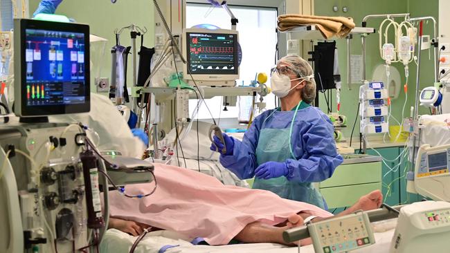 A health worker with a patient in the COVID-19 intensive care unit of the Bolognini hospital in Seriate, Bergamo, in Italy. Picture: AFP