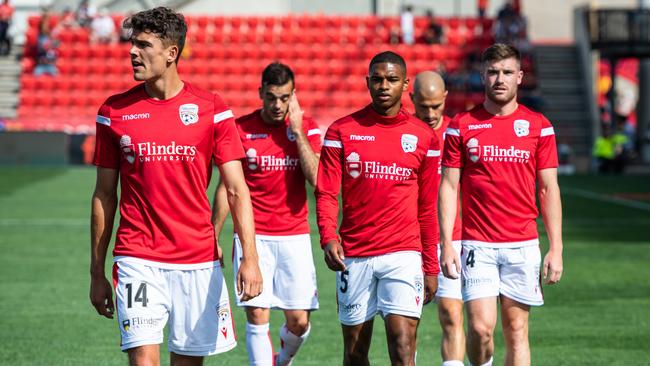 Adelaide United’s George Blackwood, Nikola Mileusnic Michael Maria, James Troisi and Ryan Strain warm up before a 5-1 loss to Western United at Coopers Stadium. (Photo by Sue McKay/Getty Images)