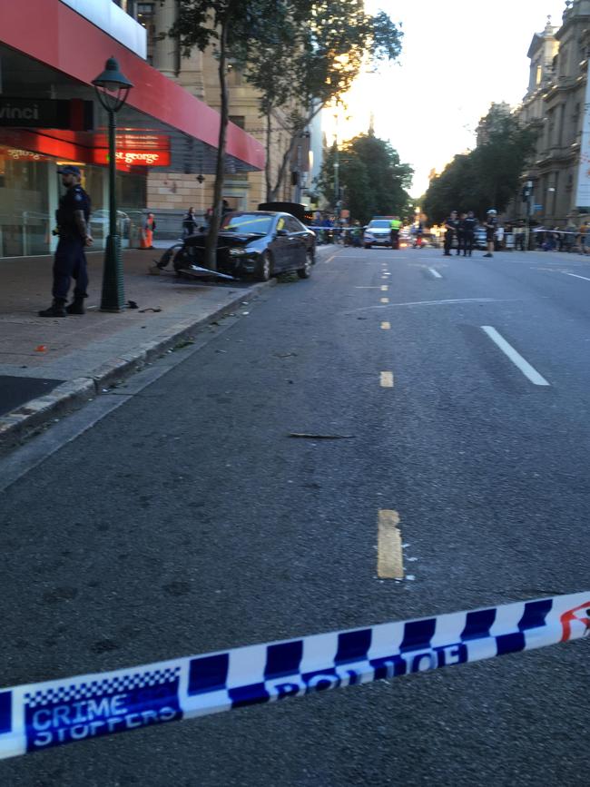 A driver lost control of their black Honda and hit pedestrians in Brisbane's CBD. Picture: Nicole Pierre