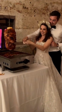 Newly-weds cut kebabs instead of cake on their wedding day