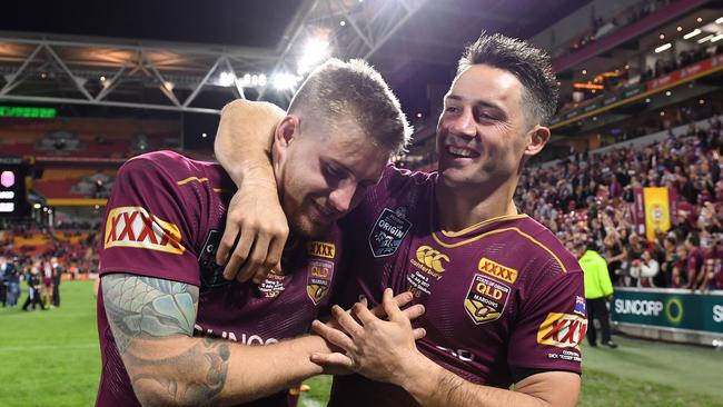 Cameron Munster (left) and Cooper Cronk of the Queensland Maroons celebrate following State of Origin Game 3.