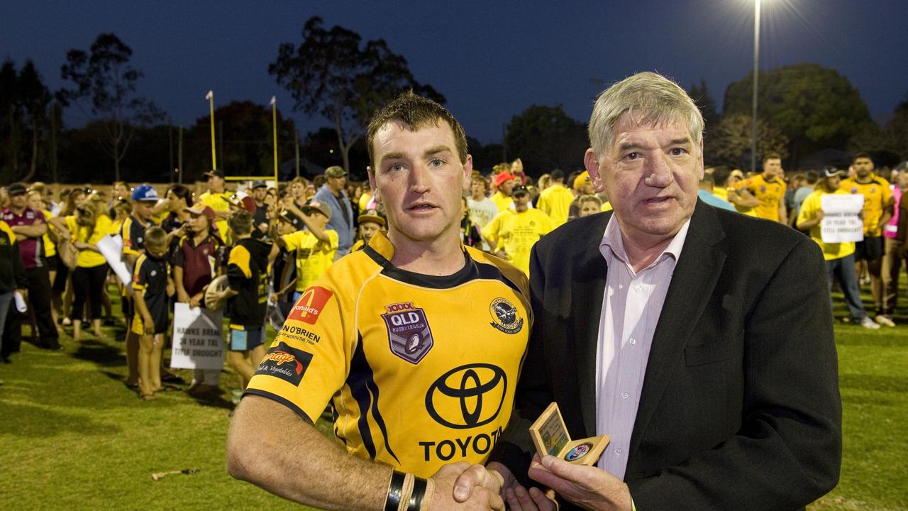 Best and fairest of the match Gatton's Jason Wilmot with John McDonald. Photo: Kevin Farmer.