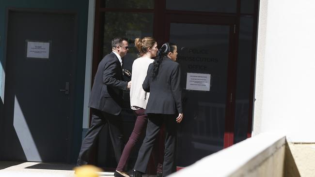 The partner of slain Gold Coast businessman Shyam `Sam' Dhody, Melissa Shaw being lead by police into the Southport Police Station-Watchhouse, over his execution-style murder.