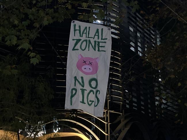 The banner was erected at the Melbourne Uni protest.