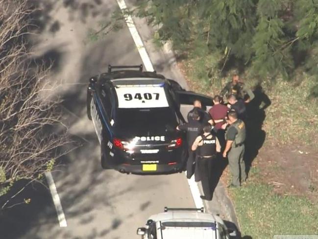 Police arrest a suspect near Marjory Stoneman Douglas High School in Parkland, Florida. Picture: NBC