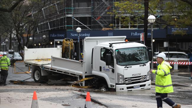 A truck sank into a hole caused by a burst water main on Bay Street, Double Bay. Picture: John Grainger